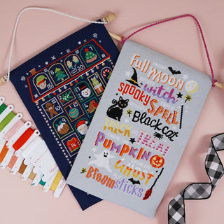 Examples of cross stitch kits turned into wall hangings