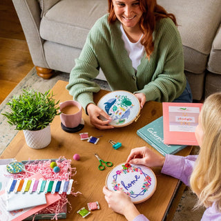 People cross stitching together