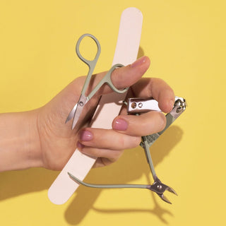 Hand holding household beauty supplies