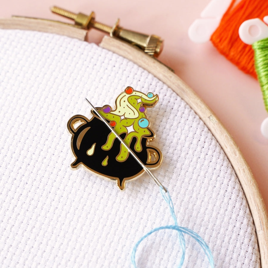 Cauldron needle minder
