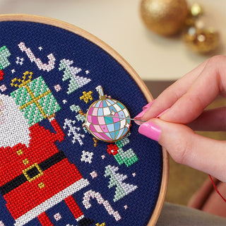 Mirror ball needle minder on Jolly Stitches sample