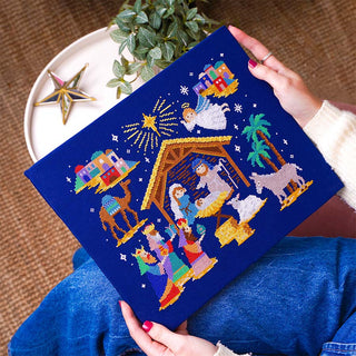 Silent Night Nativity Cross Stitch Kit Stitched Sample in hands