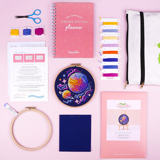 Out of this World Cross Stitch Kit - Stitched sample in 6inch Elbesee hoop flatlay with supplies and extra items