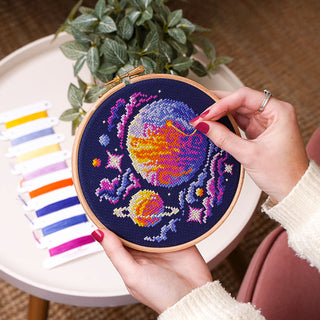 Out of this World Cross Stitch Kit - Stitching sample in hand in 6inch Elbesee hoop