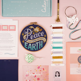 Peace on Earth Caterpillar Club Box contents flatlay