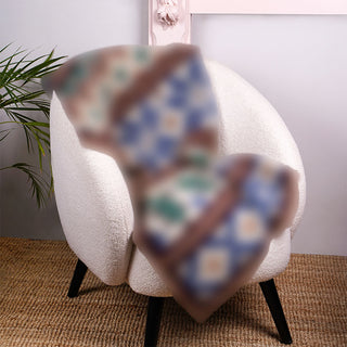 Scandi Winter Blanket mystery CAL blurred preview of full piece - on armchair for scale